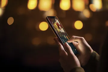 A close-up shot of golden coins falling around a spinning roulette wheel, representing immersive casino action at JL77.